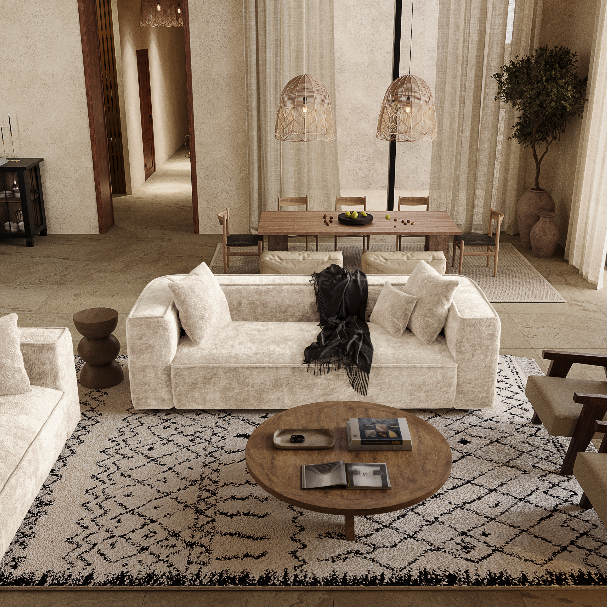 Canapé beige en velours, positionné au centre du salon pour apporter une ambiance chaleureuse cet été